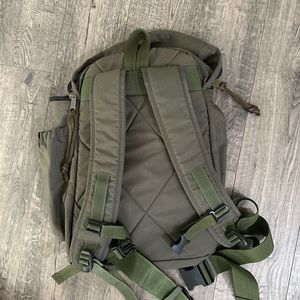 Filson on green laptop backpack